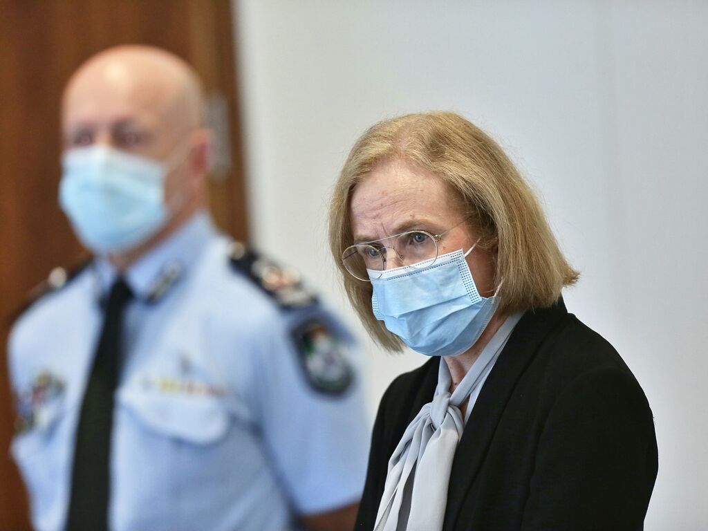 A close-up of Dr Jeanette Young addressing the media while wearing a mask